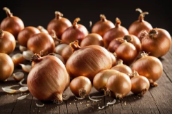 Stock Photo of Onions over wood table