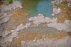 Stock Photo of Static water on the nature rocks ground