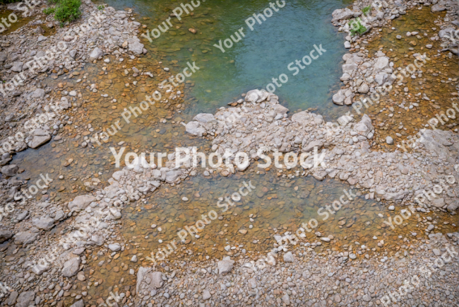 Stock Photo of Static water on the nature rocks ground