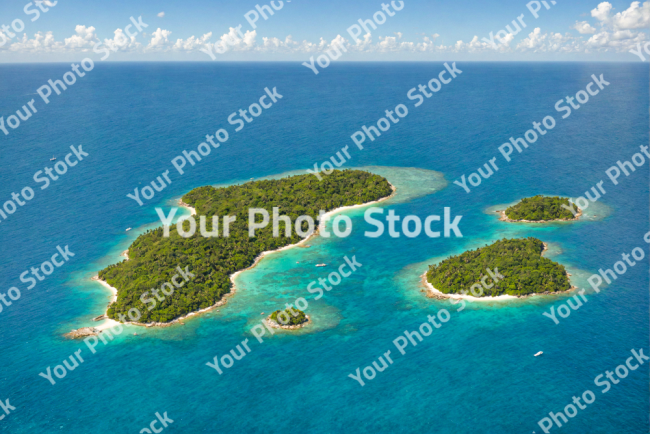 Stock Photo of Tropical islands on the blue ocean and clouds on the background