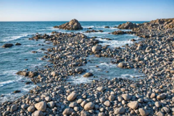Ocean coast on beach with rocks