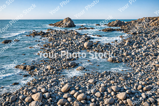 Stock Photo of Ocean coast on beach with rocks