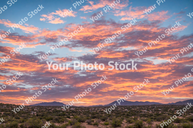 Stock Photo of Sunset Big clouds on the countryside orange clouds