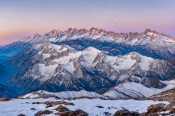 Snowy mountains at sunset at altitude