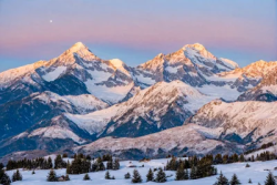 Stock Photo of Landscape of snowy mountains at dusk