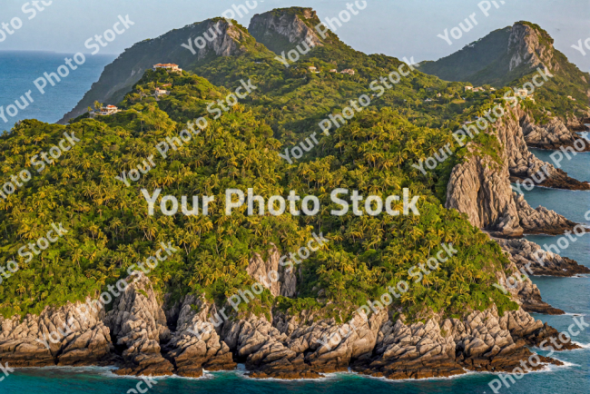 Stock Photo of Islands with large cliff on the sea with sunset