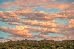 Stock Photo of Big clouds in the sky sunset desert landscape
