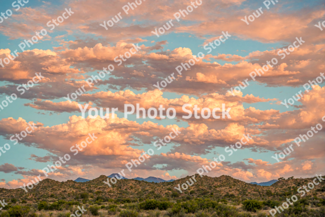 Stock Photo of Big clouds in the sky sunset desert landscape