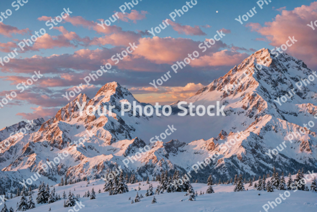 Stock Photo of Snow mountain sunset with beautiful clouds