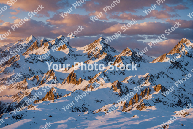 Stock Photo of Mountains wit snow in sunset day