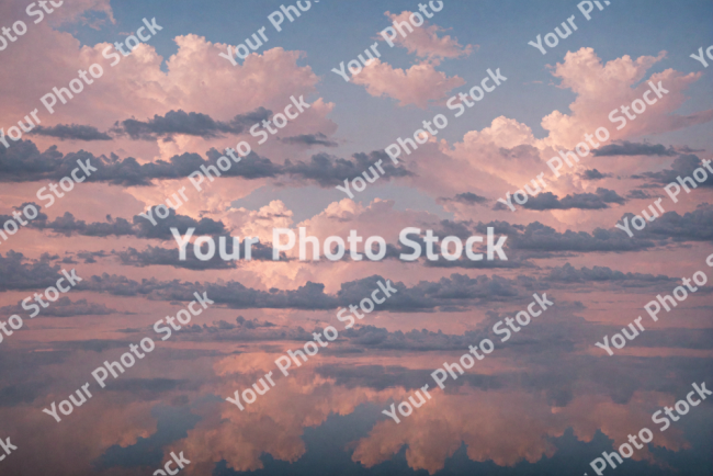 Stock Photo of Relaxing sea with clouds pink and blue pastel colors sunset