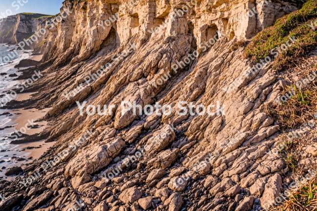 Stock Photo of Cliff rocks sea ocean sunset beachs