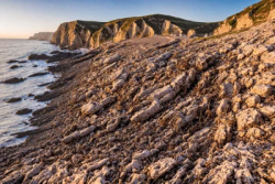 Stock Photo of Rocks landscape in the coast sunset landscape