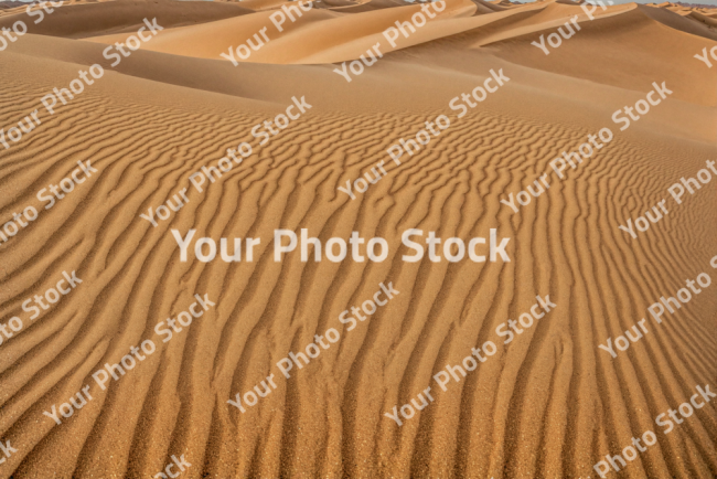 Stock Photo of Sand dunes desert in the day egypt