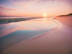 Stock Photo of Sunrise pink orange beach paradise sea