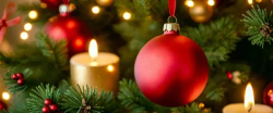 Stock Photo of Christmas sphere red decoration and candles